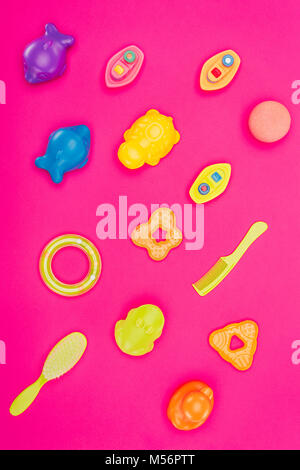 collection of baby toys and accessories isolated on pink Stock Photo
