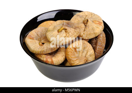 Dried figs in black plate isolated on white background Stock Photo