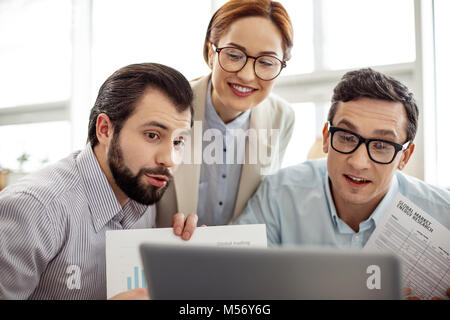 Happy startuppers having discussing project via cam Stock Photo