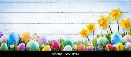 Easter - Daffodils And Eggs With Old Wooden Background Stock Photo