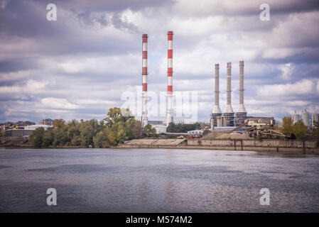 Power plant pilons rising on the shore of Sava in Belgrade Stock Photo