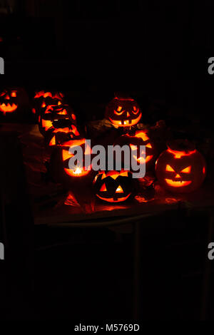 pumpkin-jack, terrible, eerie, night, black, shine, lamp, candle, red background, in the dark, carved from a pumpkin, evening, celebration, fun, laugh Stock Photo