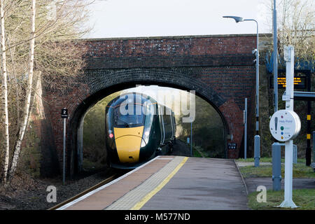 A Great Western Railway class 800 train passing through Finstock station on the Cotswold Line, Oxfordshire, England, UK Stock Photo