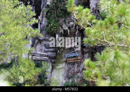 Sagada, Philippines-October 9, 2016: The Igorots practice unique funerary customs-the dead are buried in coffins tied or nailed to cliffs. Sagada-Moun Stock Photo