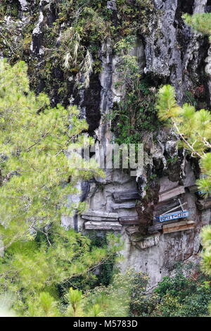 Sagada, Philippines-October 9, 2016: The Igorots practice unique funerary customs-the dead are buried in coffins tied or nailed to cliffs. Sagada-Moun Stock Photo