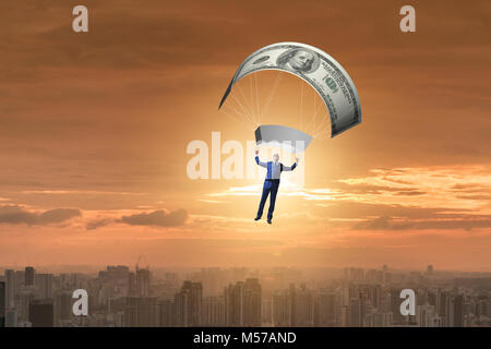 Businessman in golden parachute concept Stock Photo