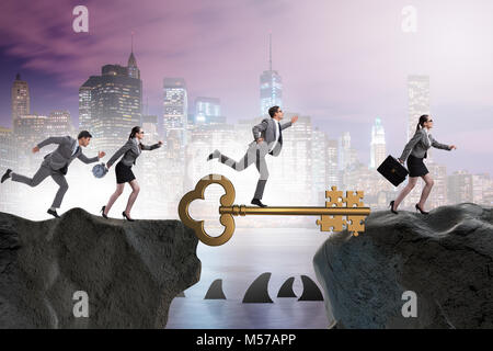 Business people chasing each other towards key to success Stock Photo