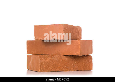 Solid clay bricks used for construction,Old red brick isolated on white background. Object isolated. Stock Photo