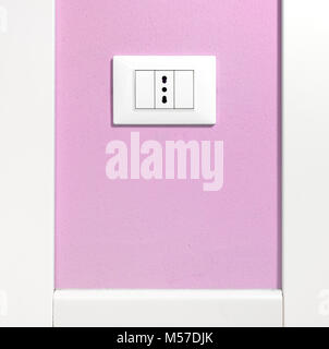 Empty wall socket on a pink interior wall Stock Photo