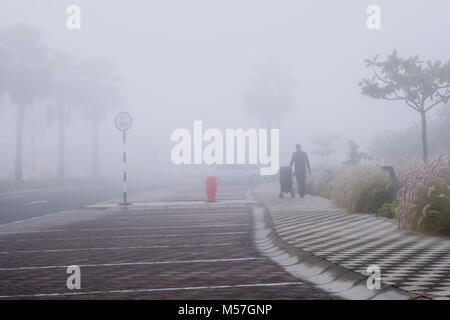 Father with his son in a buggy on Misty morning at Saadiyat Island Abu Dhabi Stock Photo