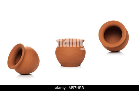 Clay pots used since ancient times on white background.soft clay pot isolated. Stock Photo