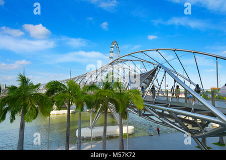 SINGAPORE - FEBRUARY 17, 2017: The Helix Bridge in Singapore. Is a bridge in the Marina Bay. The Helix is fabricated from 650 tonnes of Duplex Stainle Stock Photo
