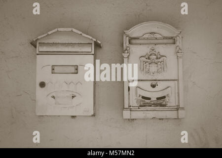 Mailbox. Two white mailboxes on a white wall. Stock Photo