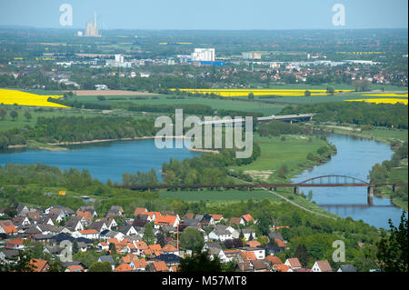 Weser River, unused railway bridge on Weser River and city of Minden and coal plant E.ON-Kraftwerk Heyden in Petershagen seen from Porta Westfalica, N Stock Photo