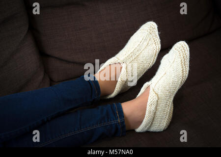 A typical production of the Balkans's handicrafts: woollen slippers knitted by hand. Artisanat des Balkans: chaussons en laine tricotés main. Stock Photo