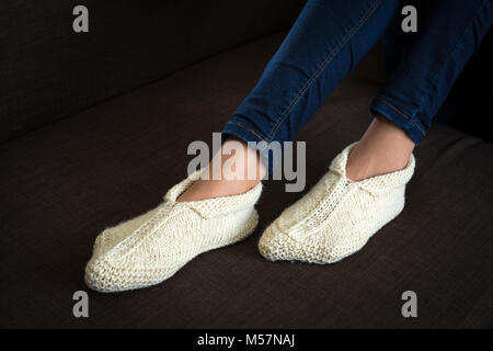 A typical production of the Balkans's handicrafts: woollen slippers knitted by hand. Artisanat des Balkans: chaussons en laine tricotés main. Stock Photo