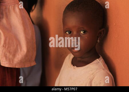 A girl with bright eyes in Kampala, Uganda. Stock Photo