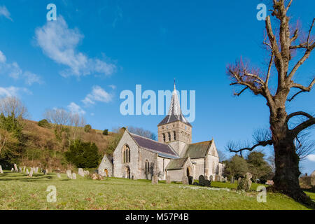Winter late afternoon sunlight and stormy clouds - Views over East Meon and All Saints Church, Hampshire, UK Stock Photo