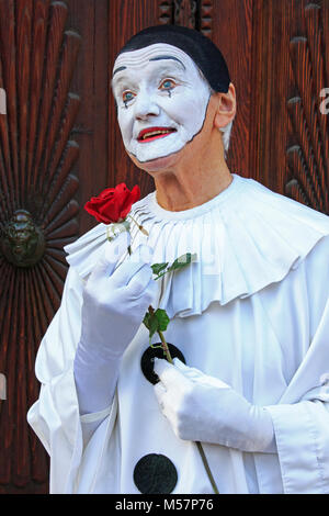 A mime artist holding a rose during the Carnival of Venice (Carnevale di Venezia) in Venice, Italy Stock Photo