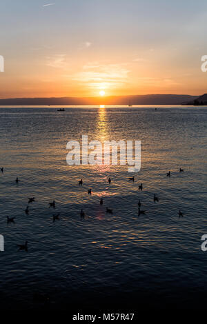 A beautiful sunset over the gorgeous lake in Switzerland Stock Photo