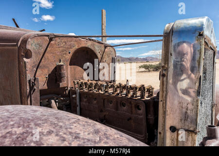 Old and abandoned car engine in the Namibia desert, spot known as solitaire. Stock Photo