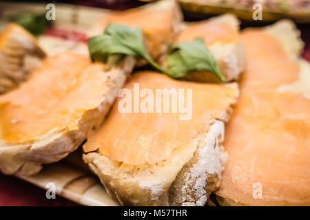 smoked salmon on bread and cream cheese spread for snacking Stock Photo