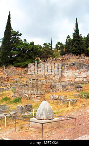 The view on Omphalos or Baetylus, the famous religious stone artifact, that was the center of the Universe for ancient greeks, Delphi, Greece Stock Photo