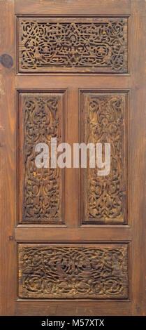 Arabesque floral engraved patterns of Fatimid style wooden ornate door leaf, Cairo, Egypt Stock Photo