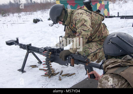 Yavoriv, Ukraine -- Ukrainian Soldiers assigned to 3rd Battalion, 14th Mechanized Brigade operate a DshK machine gun at the Yavoriv Combat Training Center (CTC) here Feb. 16. Currently the 3-14th is completing a training rotation at the CTC where they will be mentored by U.S., Canadian, Lithuanian, Polish, and U.K service members as they strive toward attaining their goal of achieving NATO interoperability. (U.S. Army photo by Sgt. Alexander Rector) Stock Photo