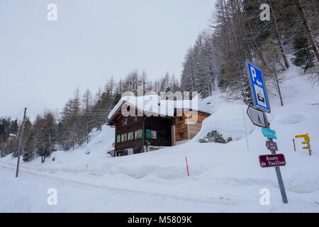 Mountain road in winter, Val d'Herens, Valais, Swiss Stock Photo