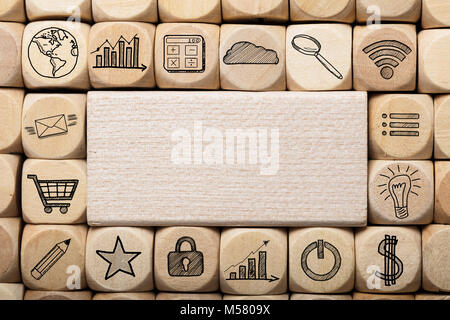 Full frame shot of wooden block surrounded by various computer icons Stock Photo