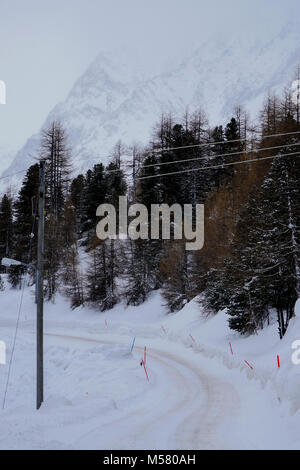 Mountain road in winter, Val d'Herens, Valais, Swiss Stock Photo