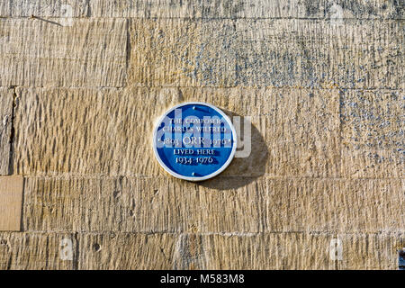 Blue plaque on the home (1934 - 1976) of composer Charles Wilfred Orr (1893 - 1976) on a wall, St Mary's Street, Painswick, Gloucestershire Cotswolds Stock Photo