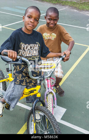 Miami Florida,Liberty City,African Square Park,inner city,low income,poverty,economic,Black Blacks African Africans ethnic minority,boy boys,male kid Stock Photo