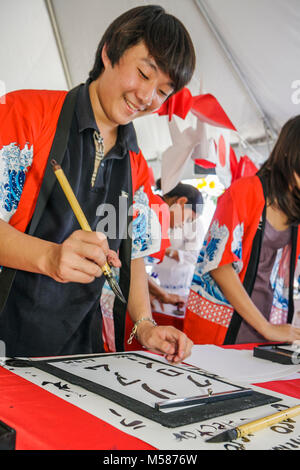 Miami Florida,Homestead,Redlands,Fruit & Spice Park,Asian Culture Festival,festivals fair,Japanese calligraphy,boy boys,male kid kids child children y Stock Photo