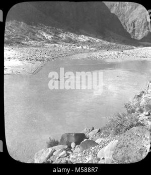 Grand Canyon Matthes Survey of . BLACK AND WHITE GLASS LANTERN SLIDE.  BOAT IN THE COLORADO RIVER. GOLD/ PAPER SLIDE FRAME WITH RED STAR. CIRCA 1902. WITH A GROUP OF SLIDES FROM THE MATTHES SURVEY EXPEDITION IN THE GRAND CANYON - CIRCA 1902 Stock Photo