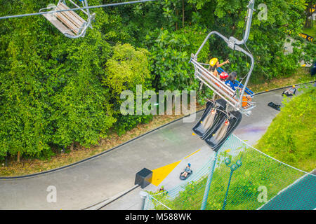 SINGAPORE, SINGAPORE - JANUARY 30, 2018: Outdoor view of unidentified friends at Singapore Sentosa Cable Car and Skyline Luge, Singapore Stock Photo