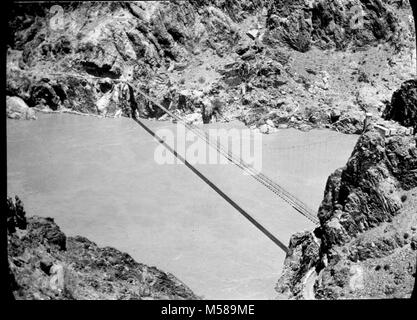 Grand Canyon Matthes Survey of . BLACK AND WHITE GLASS LANTERN SLIDE. OLD SUSPENSION BRIDGE ACROSS THE COLORADO RIVER. PAPER/GOLD SLIDE FRAME CIRCA 1923. WITH A GROUP OF SLIDES FROM THE MATTHES SURVEY EXPEDITION IN THE GRAND CANYON. Stock Photo