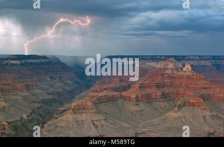 Grand Canyon Nat Park Lightning Danger Mather Point . Summer storms in the southwest are often accompanied by potentially deadly lightning. Visitors walking and hiking in the park are reminded that if they can hear thunder, they should consider ending outdoor activities.   If the sound of thunder follows a lightning flash within 30 seconds, seek shelter inside a building or vehicle. If this is not possible, move well away from high points such as ridges and the edge of the canyon. Do not seek shelter beneath tall trees. Lightning strikes within Grand Canyon National Park an average of 26,073 t Stock Photo