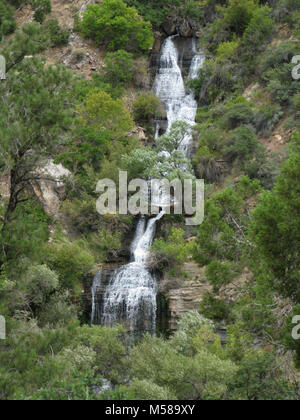 Grand Canyon Nat Park N Kaibab Trail   Roaring Springs. Where the descending North Kaibab Trail meets the flatter bottom of Bright Angel Canyon, 5 miles/ 8 km from the North Kaibab Trailhead, Roaring Springs may be seen. Here, water gushes forth directly out of the cliffs, cascading over moss and fern to form Bright Angel Creek (which will be a constant companion all the way to the Colorado River).   This giant spring provides drinking water for every visitor and resident within Grand Canyon National Park. The water is delivered to the South Rim via a pipeline buried beneath the North Kaibab T Stock Photo