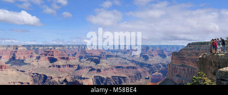 Grand Canyon National Park Mohave Point. (3600 x 1340) Viewing the Grand Canyon from Mohave Point on the Hermit Road, Grand Canyon National Park.  Hermit Road is a scenic route along the west end of Grand Canyon Village on the South Rim which follows the rim for 7 miles (11 km) out to Hermits Rest. This extremely popular route is accessed by free park shuttle bus, foot, bicycle, or commercial bus tour most of the year, with private vehicles allowed only during winter months.  Along the rim are nine designated viewpoints where the free Hermits Rest Route shuttle bus stops. The Rim Trail also fo Stock Photo