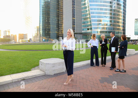 Close up face secretary looking at camera with document case in  Stock Photo