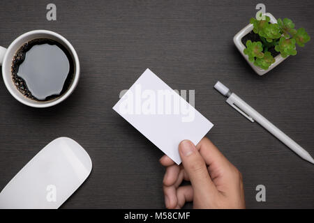 Mockup of white business cards in man's hand Stock Photo