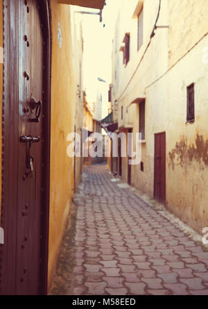 Narrow street in Moroccan city Stock Photo