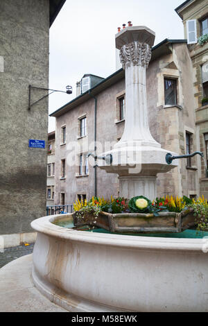 Street fountain in old town of Geneva city, Switzerland Stock Photo