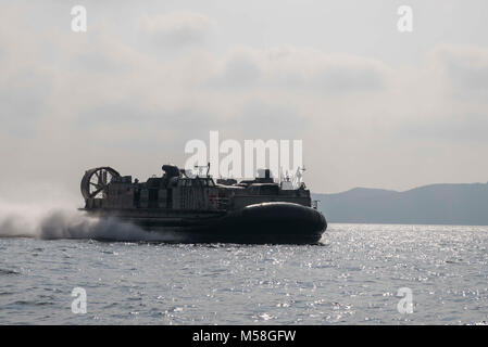 180216-N-RD713-034  GULF OF THAILAND (Feb. 16, 2018) Landing Craft Air Cushion 9, assigned to Naval Beach Unit 7, transports Marines and vehicles from the amphibious assault ship USS Bonhomme Richard (LHD 6) to shore as part of Exercise Cobra Gold 2018. Bonhomme Richard is participating in CG18 alongside Royal Thai Navy ships and personnel, conducting a range of amphibious operations that will enhance the tactical expertise of participants and rehearse combined capabilities to improve interoperability. Cobra Gold is one of the largest exercises in the Indo-Pacific. Cobra Gold is an annual exer Stock Photo