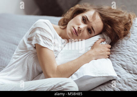 Depressed woman thinking about something serious Stock Photo