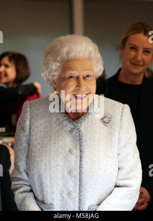 Queen Elizabeth II reacts as she visits London Fashion Week's BFC Show Space in central London. Stock Photo