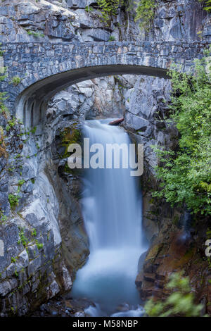 Christine Falls framed by a stone bridge in Mt Rainier National Park, Washington Stock Photo