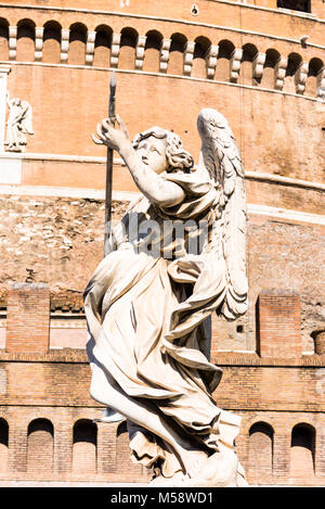 Bernini's baroque angel sculptures on Ponte Sant' Angelo bridge with Castel Sant'Angelo (Castle of Holy angel). Rome. Lazio. Italy. Stock Photo